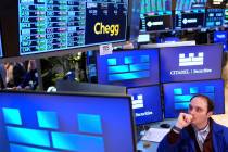 Joseph Maguire works on the floor at the New York Stock Exchange in New York, Tuesday, April 8, ...