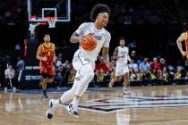 Central Florida guard Mikey Williams brings ball down court against Iowa State during the first ...
