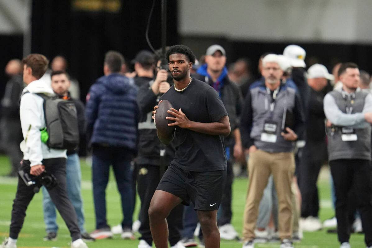 Colorado quarterback Shedeur Sanders (2) takes part in passing drills during Colorado's NFL foo ...