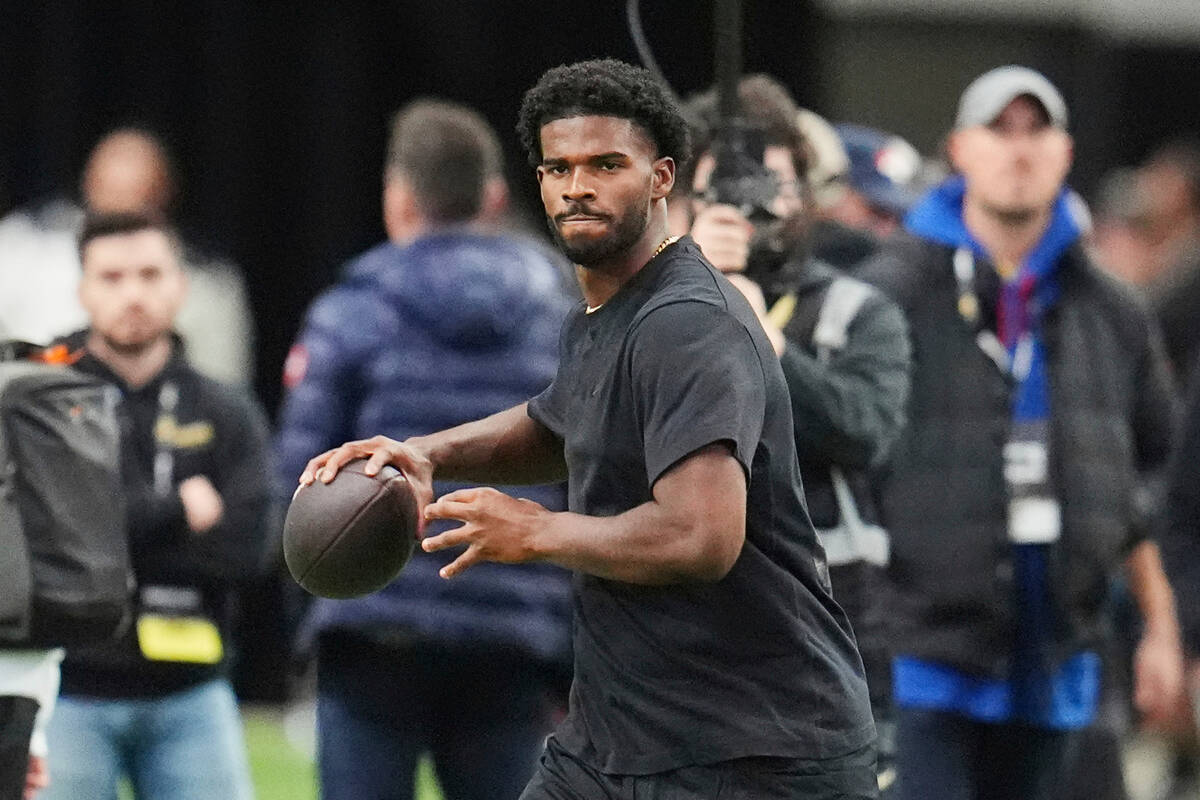 Colorado quarterback Shedeur Sanders takes part in passing drills during Colorado's NFL footbal ...