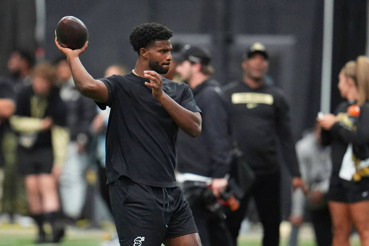 Colorado quarterback Shedeur Sanders (2) takes part in passing drills during Colorado's NFL foo ...