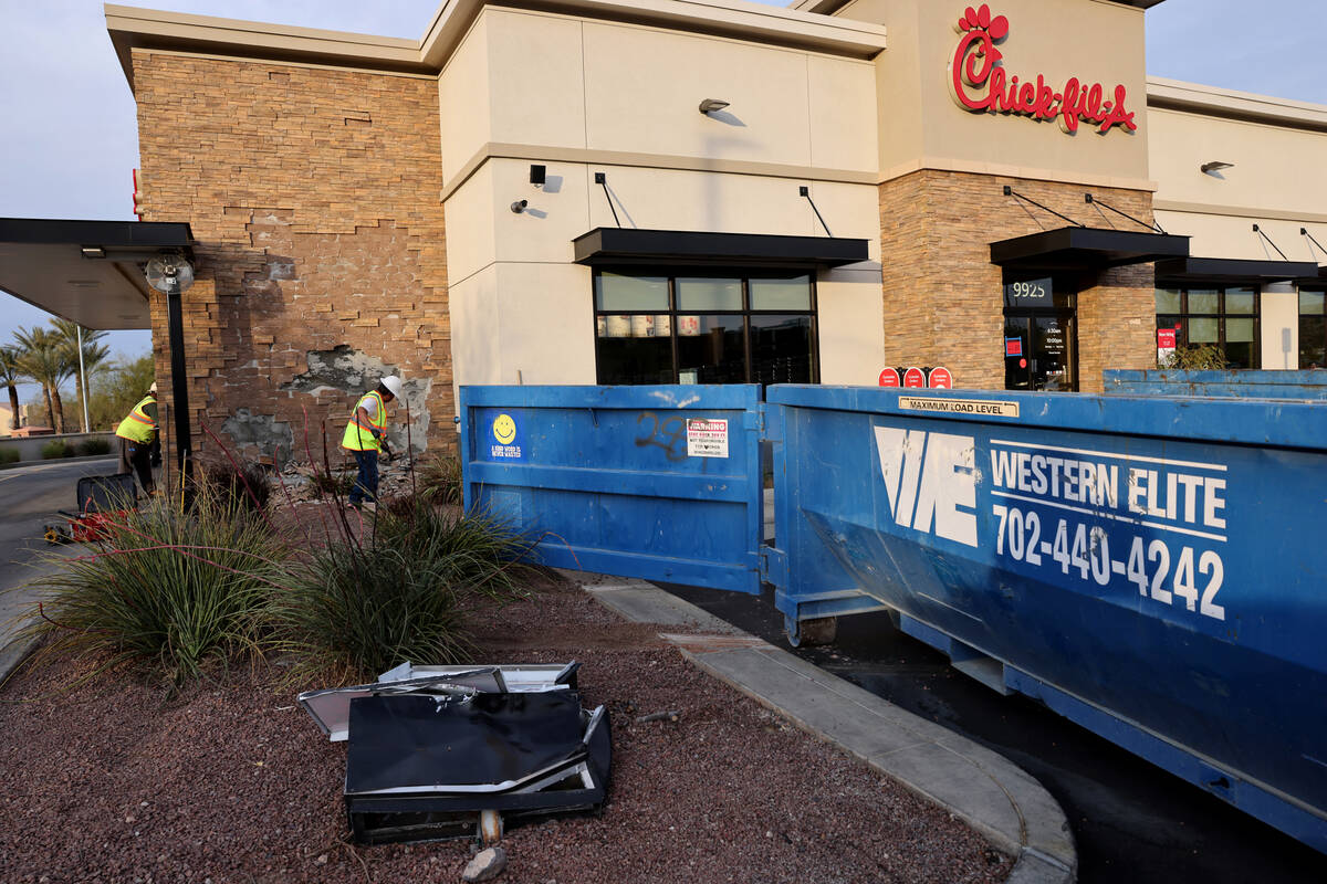 A smashed “do not enter” sign is seen as workers make preparations to repair a Ch ...