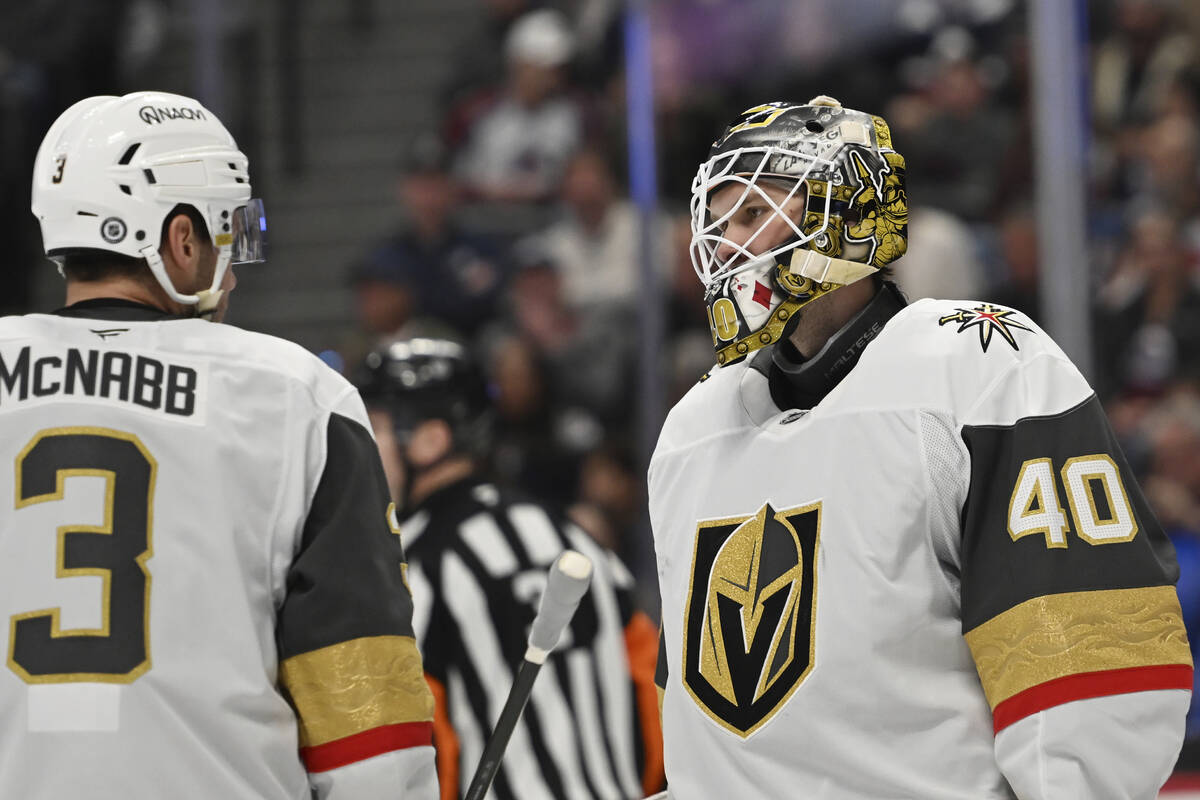 Vegas Golden Knights defenseman Brayden McNabb (3) and goaltender Akira Schmid (40) talk during ...