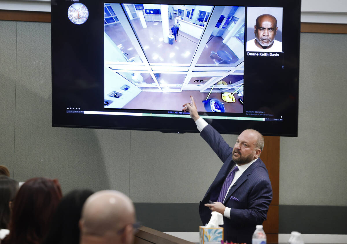 Chief Deputy District Attorney Marc DiGiacomo points to a video display that shows the Clark Co ...