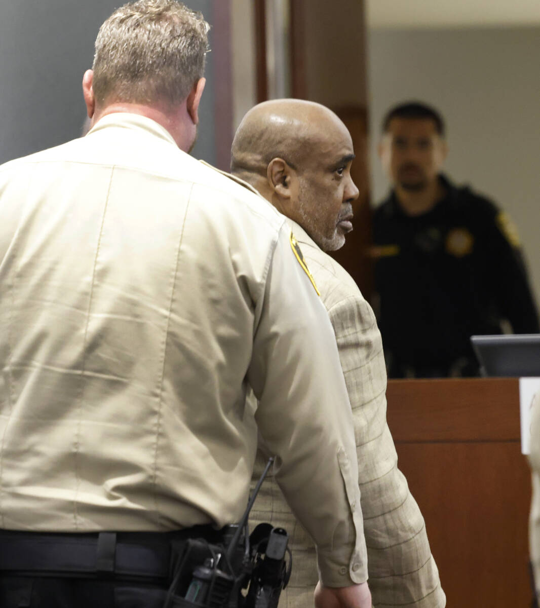 Duane Davis is escorted out of a courtroom after his trial at the Regional Justice Center, on W ...