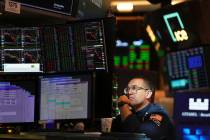 Anthony Matesic works on the floor at the New York Stock Exchange in New York, Wednesday, April ...