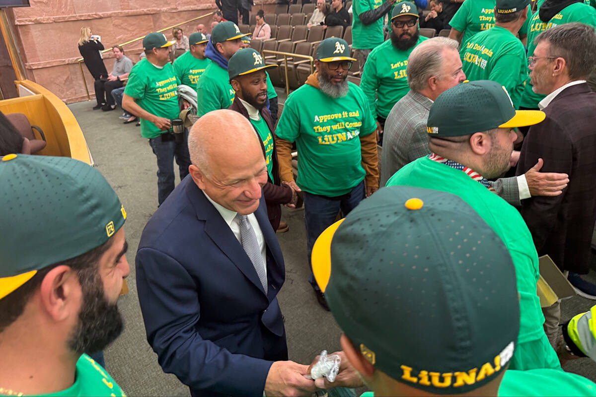 Athletics President Marc Badain and Las Vegas Aviators President Don Logan meet members of Labo ...