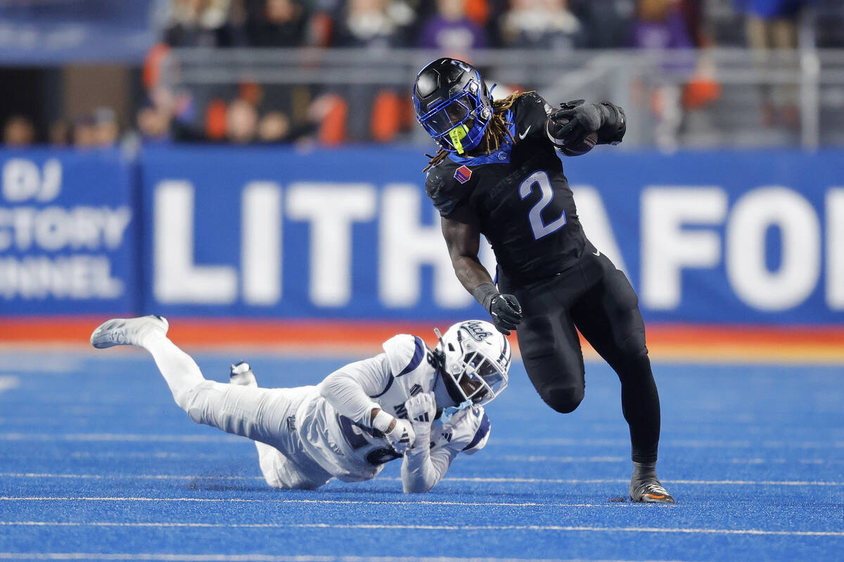 Boise State running back Ashton Jeanty (2) runs through the tackle attempt by Nevada defensive ...