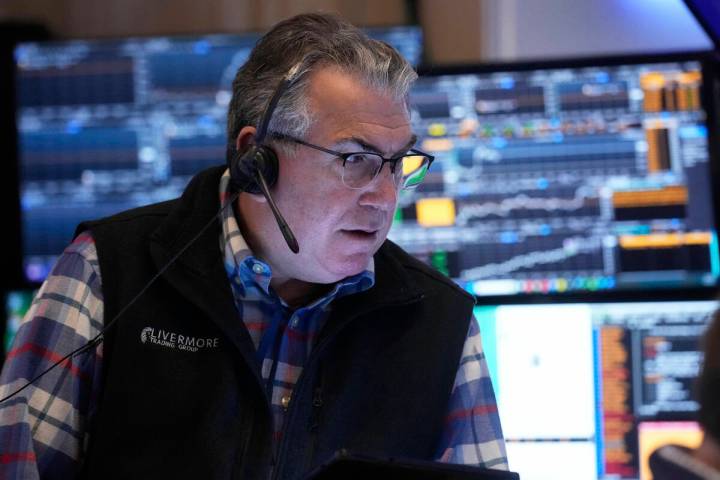Trader John Bishop works on the floor of the New York Stock Exchange, Thursday, April 10, 2025. ...