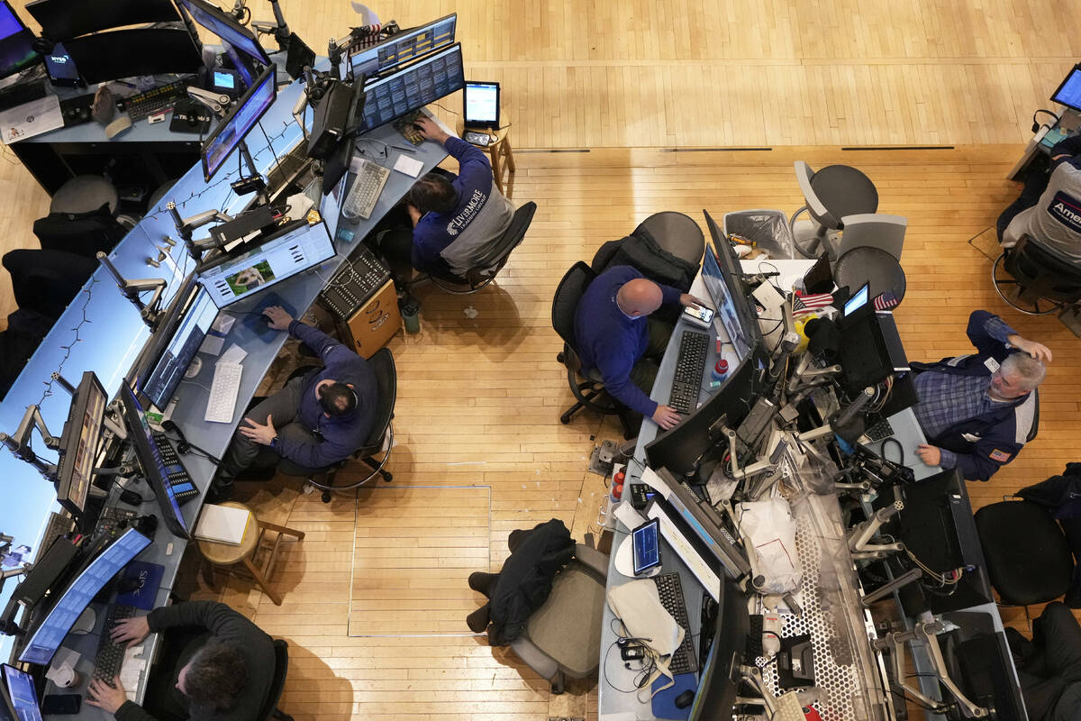 Traders work on the floor of the New York Stock Exchange, Thursday, April 10, 2025. (AP Photo/R ...
