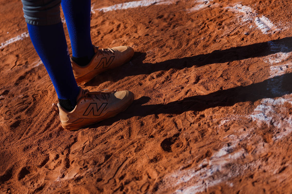 A Basic player warms up before going tp bat during a softball game between Basic and Doral Acad ...