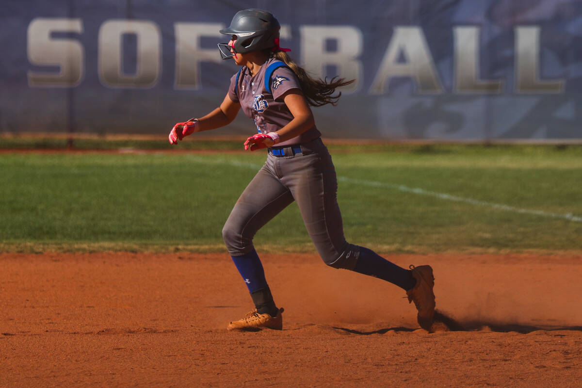 Basic Academy’s Mia Frias (22) runs to second base during a softball game between Basic ...