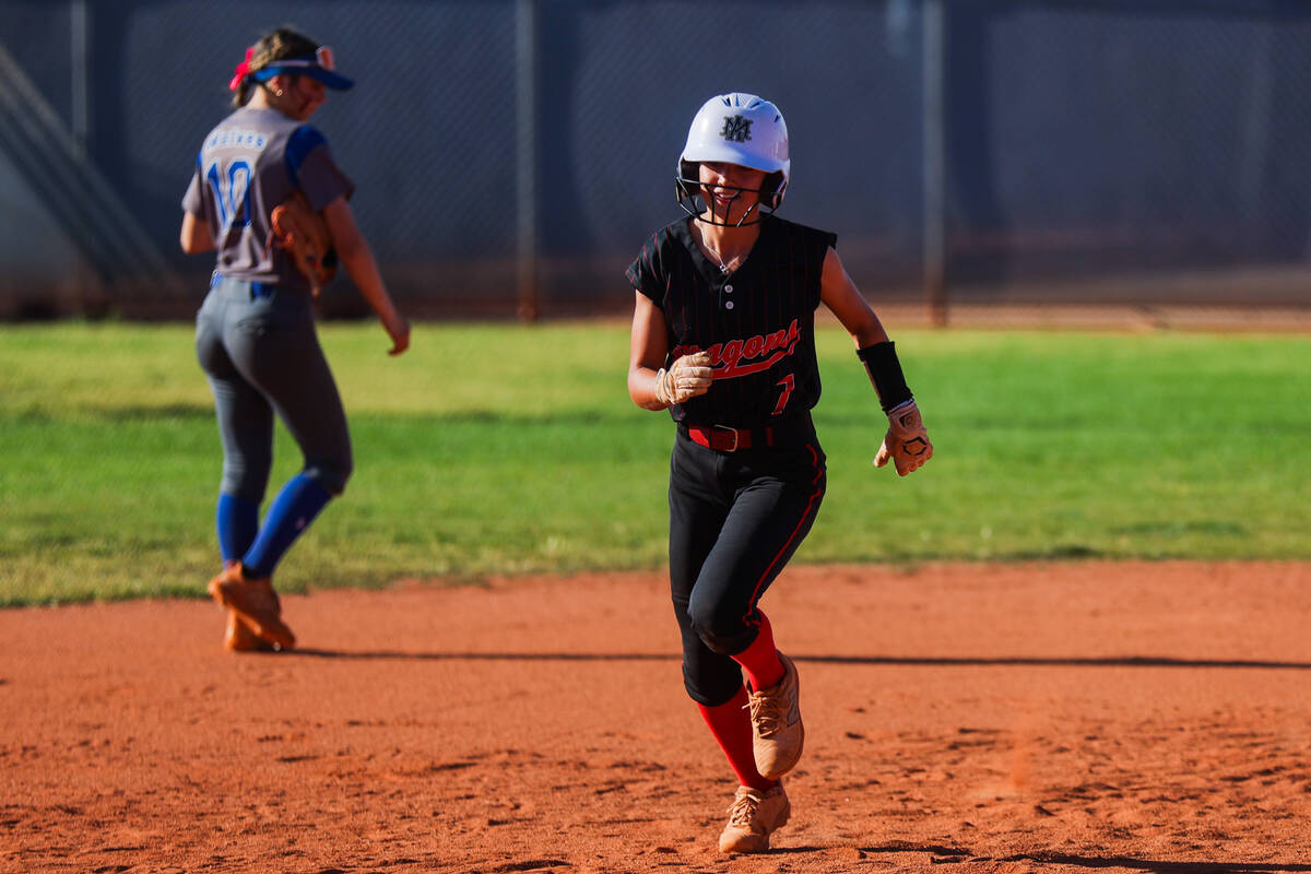 Doral Academy pitcher EmmaLynn Hussey runs to third base during a softball game between Basic a ...