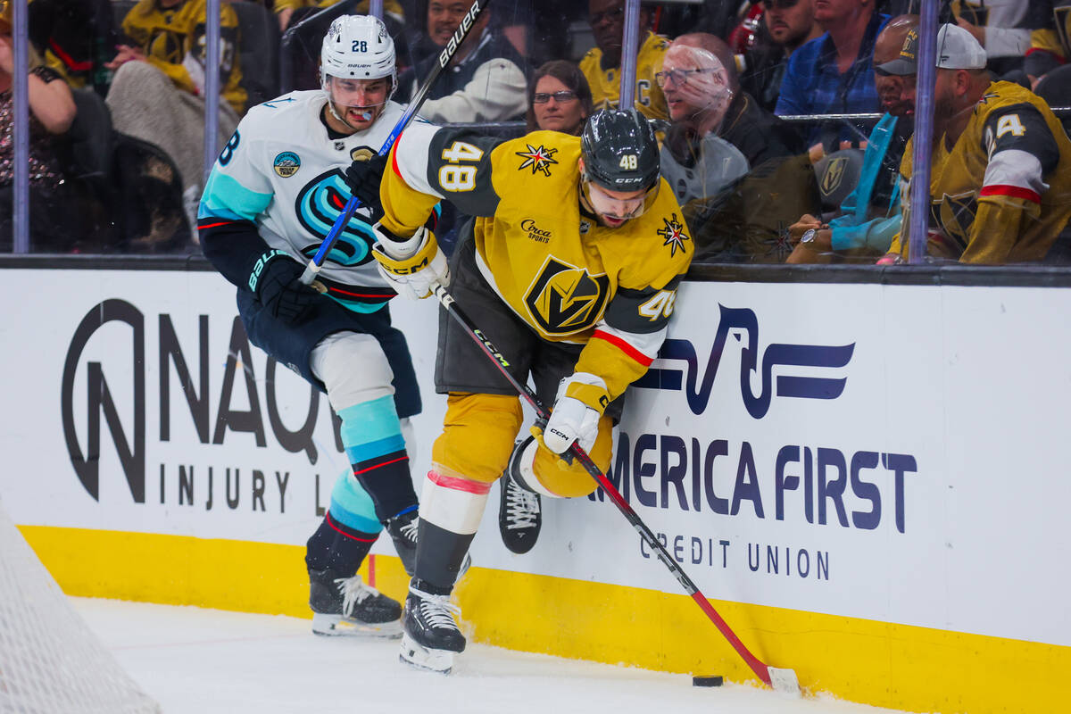 Golden Knights center Tomas Hertl (48) closes Seattle Kraken defenseman Joshua Mahura (28) out ...
