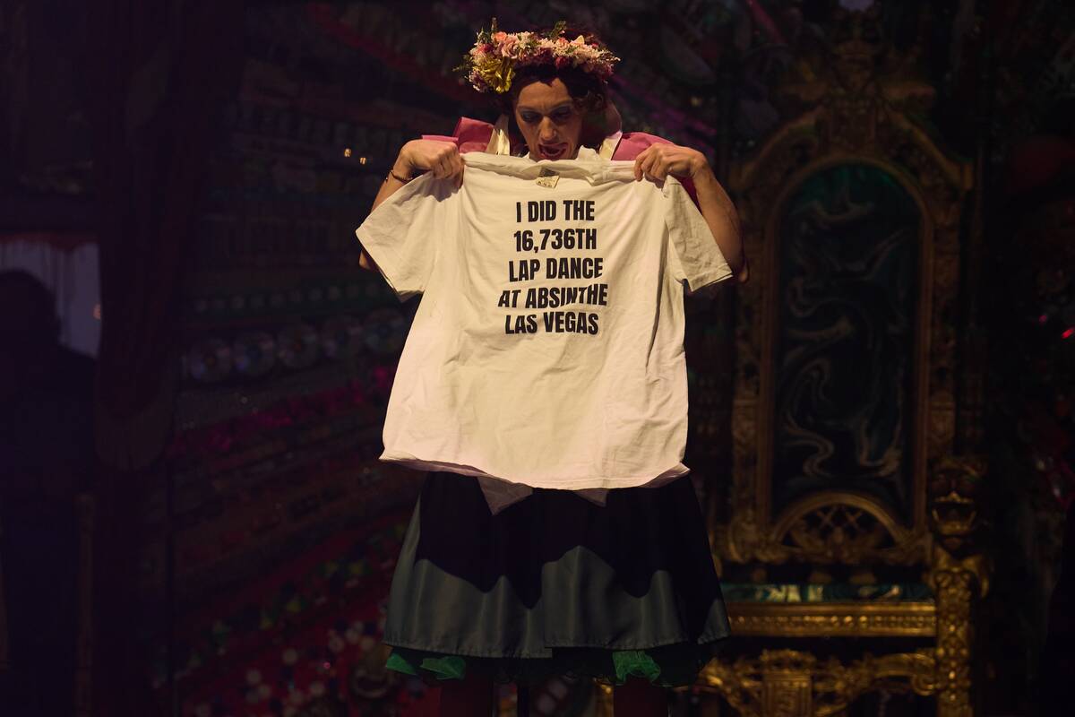 Sarah Lowe as Wanda Widdles shows off the prize for the 16,736th Lap Dance during Absinthe's 14 ...