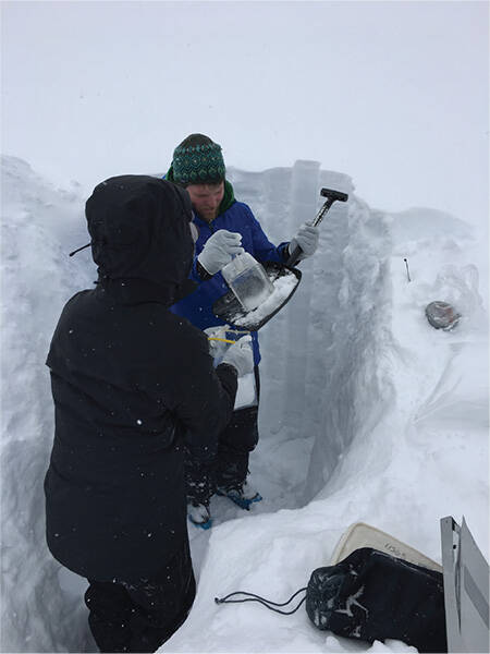 The research team collects snow samples in the Rocky Mountains in the spring of 2018. (Desert R ...