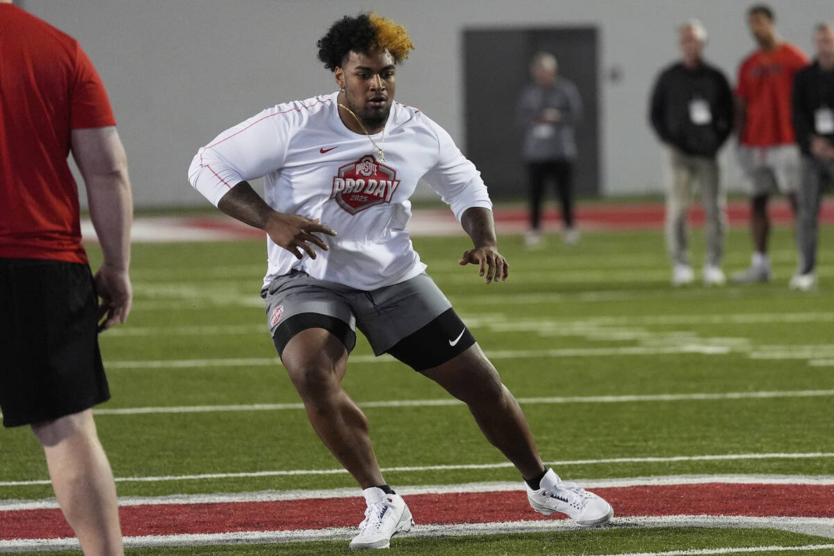 Ohio State offensive lineman Josh Simmons participates in a drill during the school's NFL footb ...