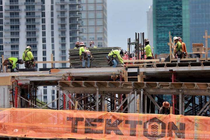 Construction workers on a job site on May 5, 2023, in Miami. (Joe Raedle/Getty Images/TNS)