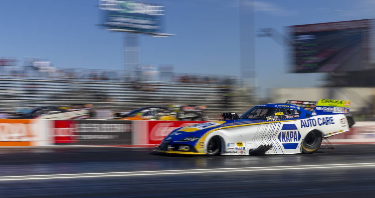 Funny Car driver Ron Capps leaves the starting line during qualifying for the NHRA 4-Wide Natio ...