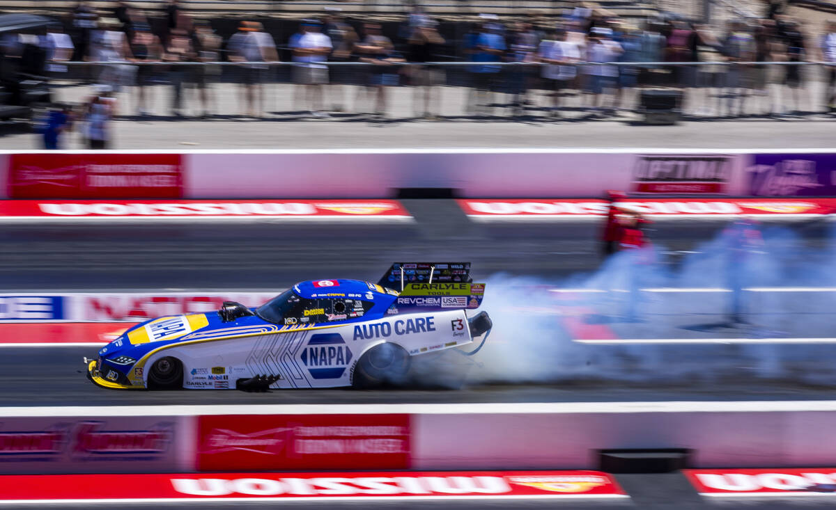 Funny Car driver Ron Capps warms up his tires during qualifying for the NHRA 4-Wide Nationals a ...
