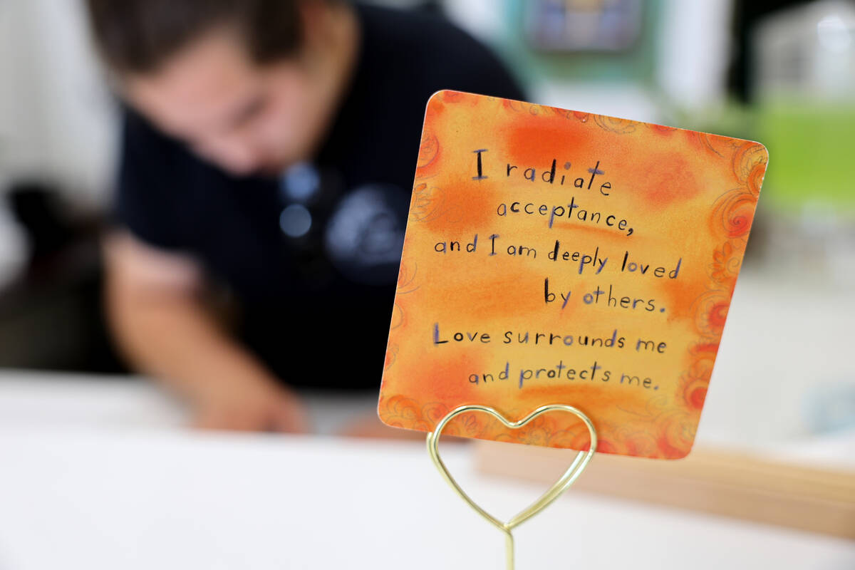 A daily motivational card is seen at The Blooming Bistro, a restaurant that employs at-risk you ...