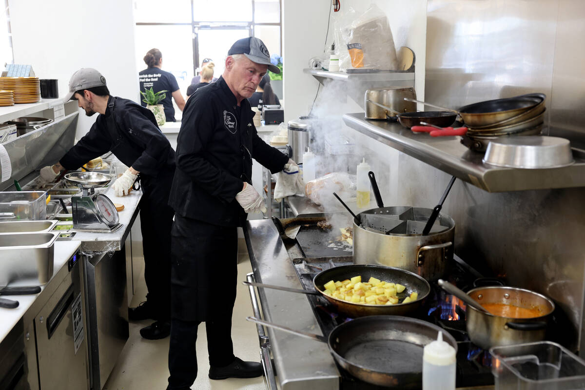 Chef Calvin Shiflet, right, and Assistant Chef Sean Hedstrom prepare food at The Blooming Bistr ...