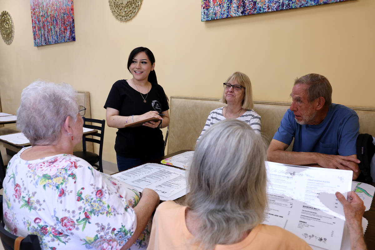 Jennifer Barios, 19, takes orders at The Blooming Bistro in Las Vegas Friday, April 11, 2025. T ...