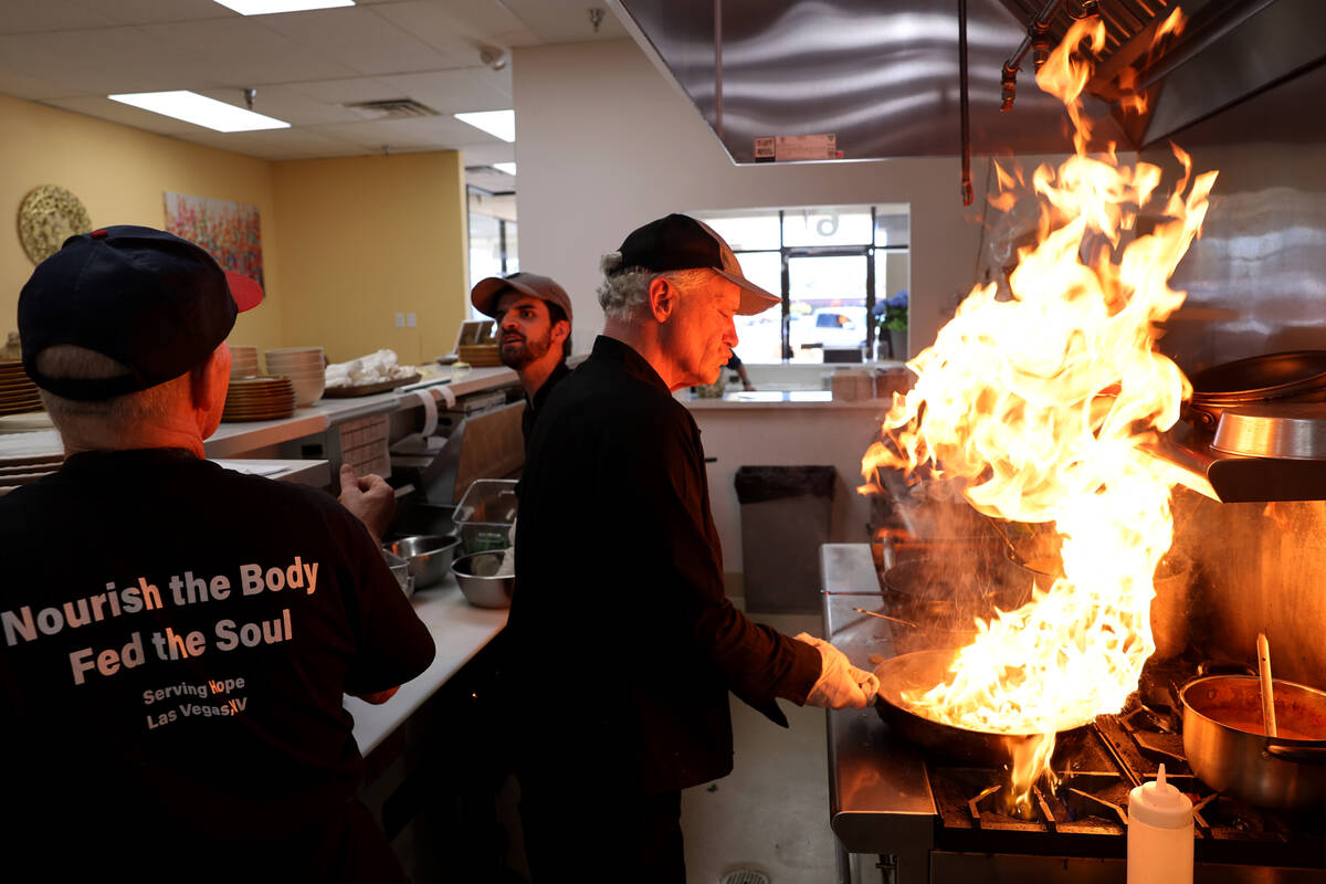 Chef Calvin Shiflet, right, prepares food at The Blooming Bistro in Las Vegas Friday, April 11, ...