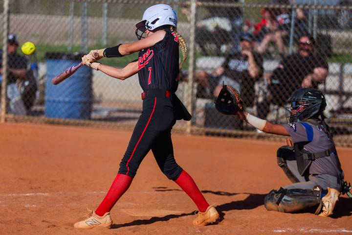 Doral Academy pitcher EmmaLynn Hussey hits the ball during a softball game between Basic and Do ...