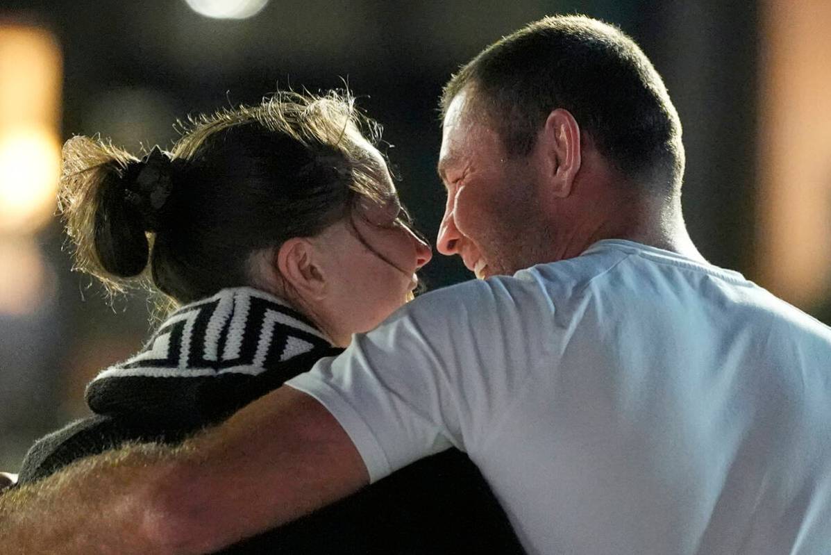 Ksenia Karelina walks with her fiancé, professional boxer Chris van Heerden, as she arrive ...