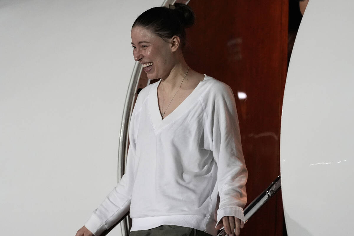 Ksenia Karelina arrives Thursday, April 10, 2025, at Joint Base Andrews, Md. (AP Photo/Alex Bra ...