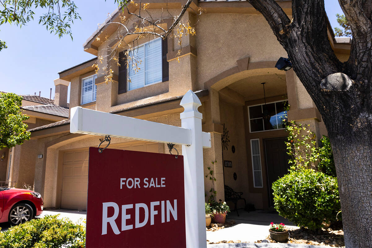 A "For Sale" sign is posted outside a single family house at Novara Lane on Wednesday, June 15, ...