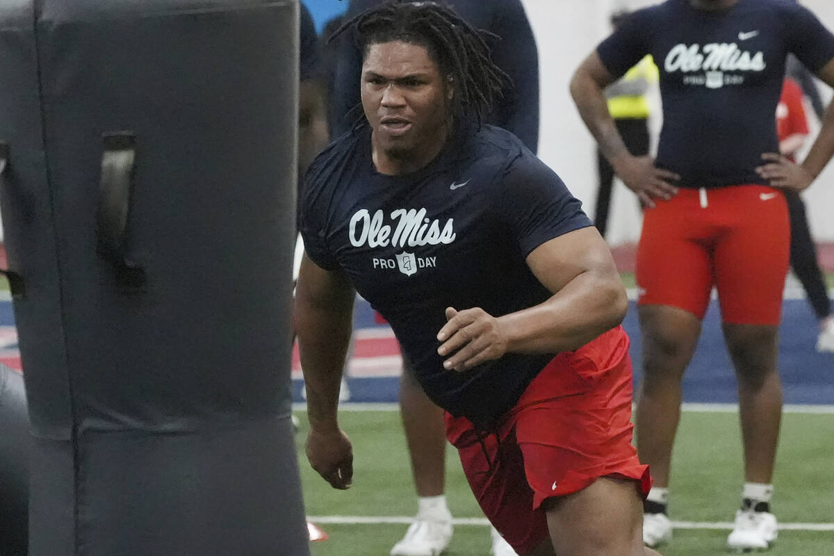 Mississippi defensive tackle Walter Nolen confronts a blocking dummy during a drill at the scho ...
