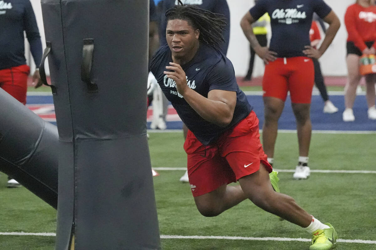 Mississippi defensive tackle Walter Nolen confronts a blocking dummy during a drill at the scho ...