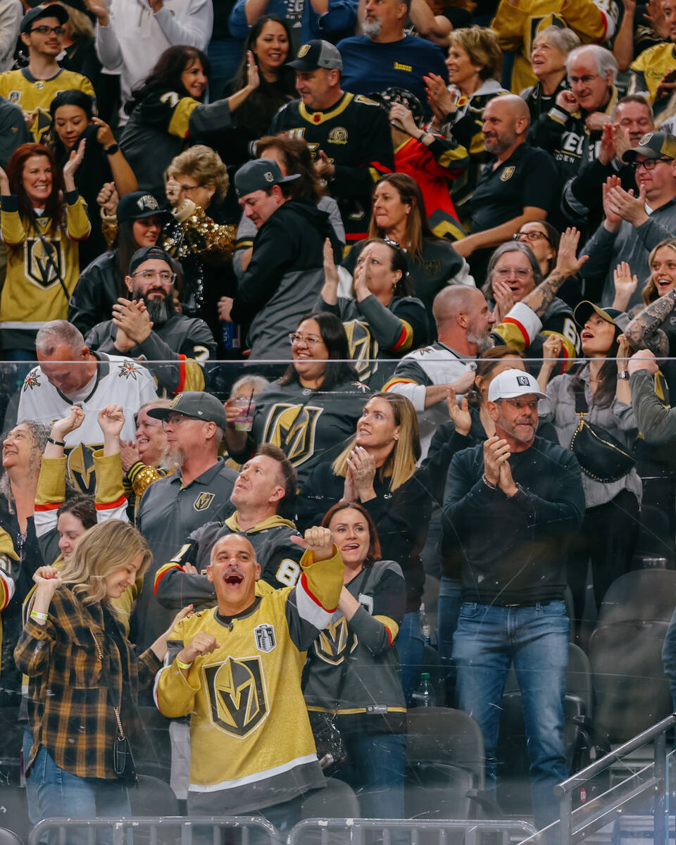 Fans celebrate the Golden Knights’ fourth goal during the third period of the last home ...