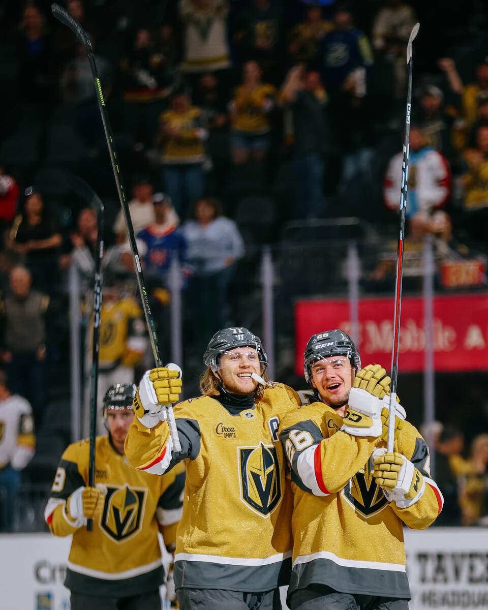 Golden Knights center William Karlsson (71) and right wing Alexander Holtz (26) celebrate their ...