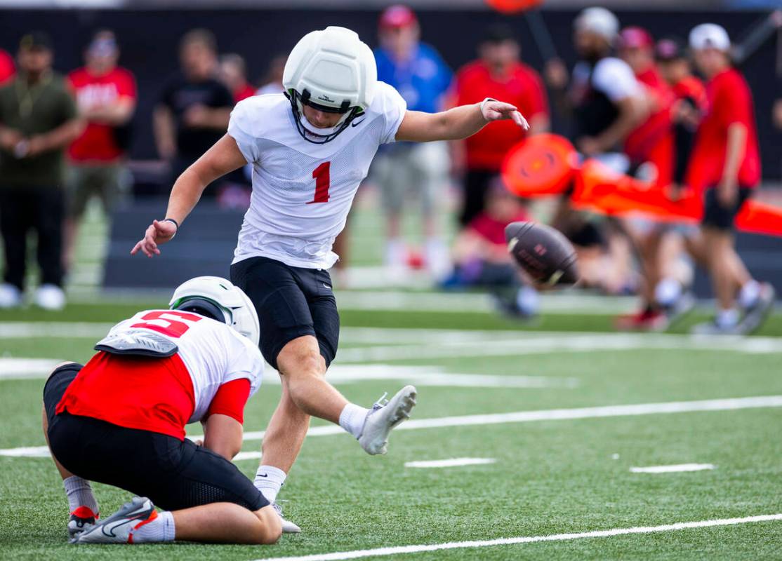 UNLV kicker Caden Costa (1) kicks another field goal with a hold by punter Konner Melzer (5) d ...