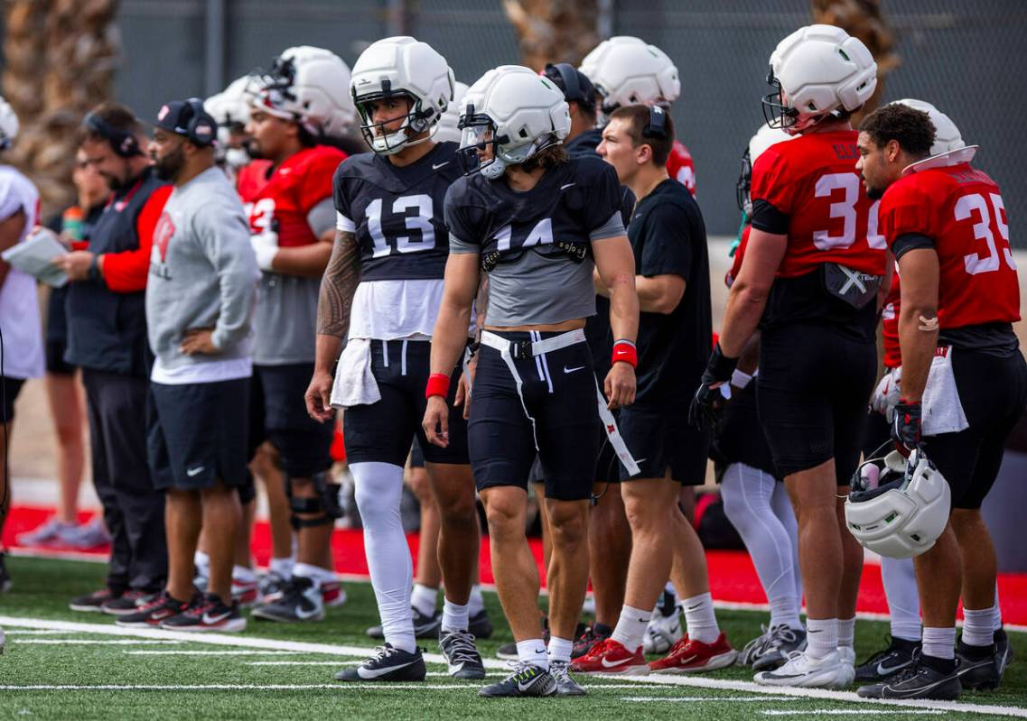 UNLV quarterbacks Gael Ochoa (14) and Cameron Friel (13) watch the play during football spring ...