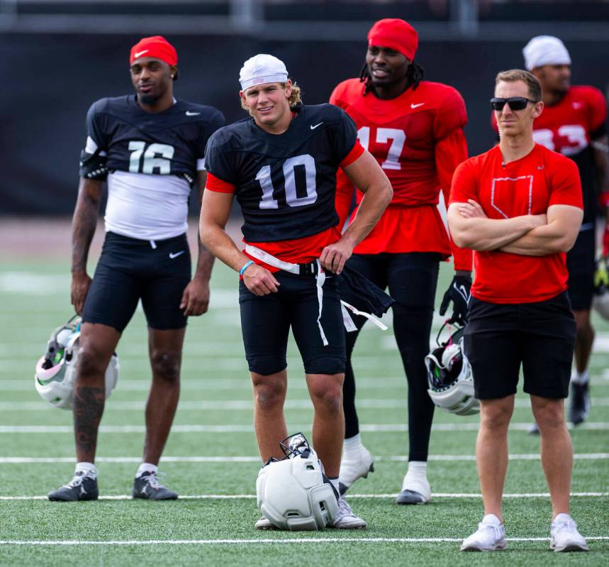 UNLV quarterback Anthony Colandrea (10) with receiver Daejon Reynolds (16) and wide receiver Tr ...