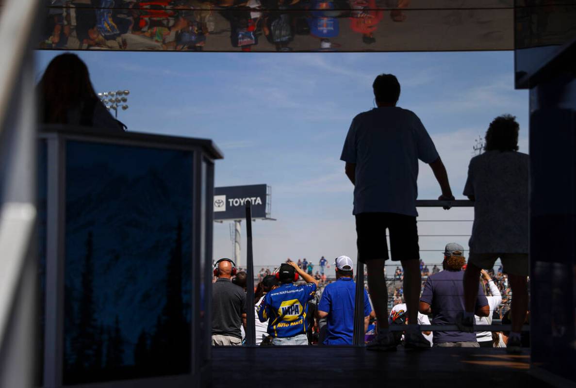 Race fans take in the action during the NHRA 4-Wide Nationals at The Strip at Las Vegas Motor S ...