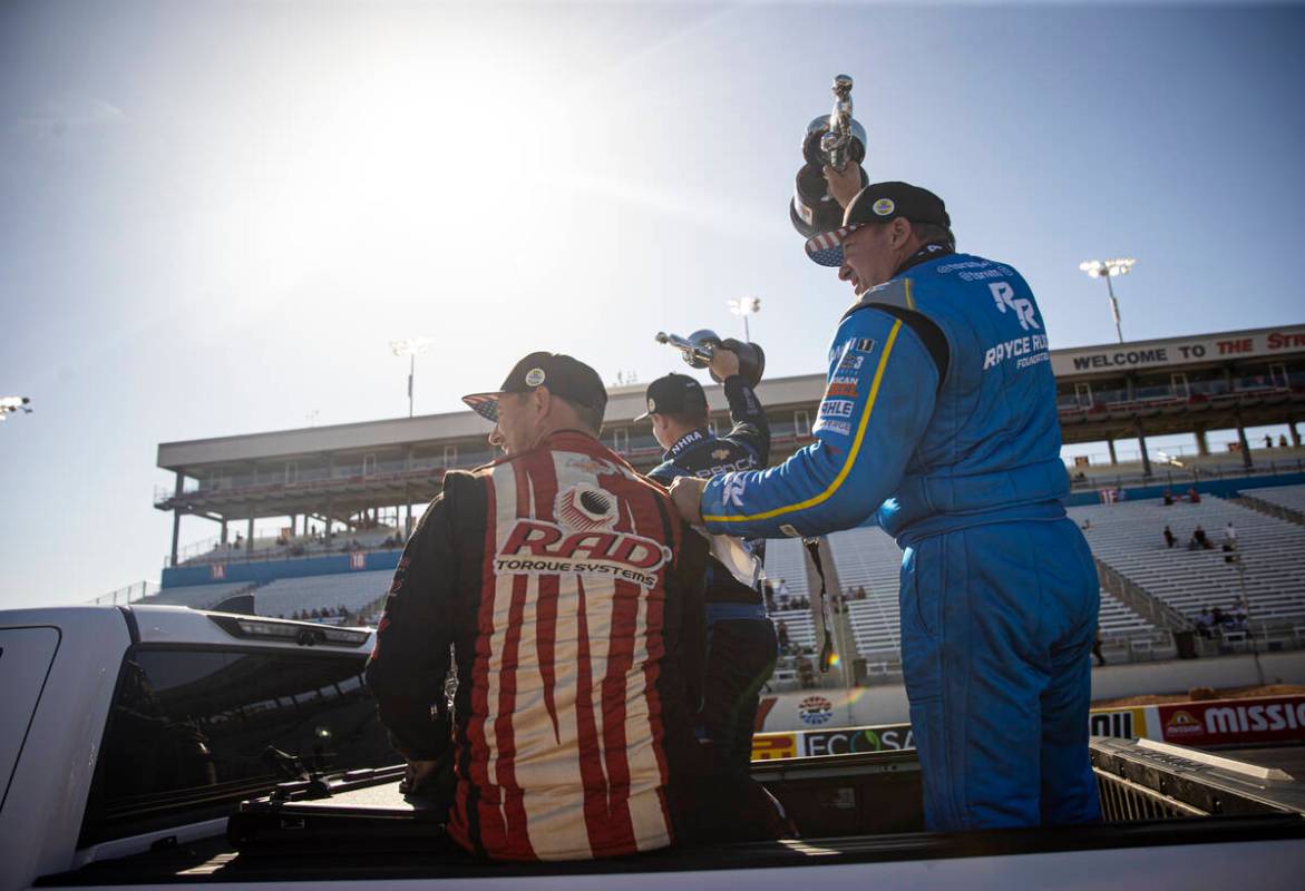 Top Fuel driver Tony Stewart, right, celebrates his victory during the NHRA 4-Wide Nationals at ...