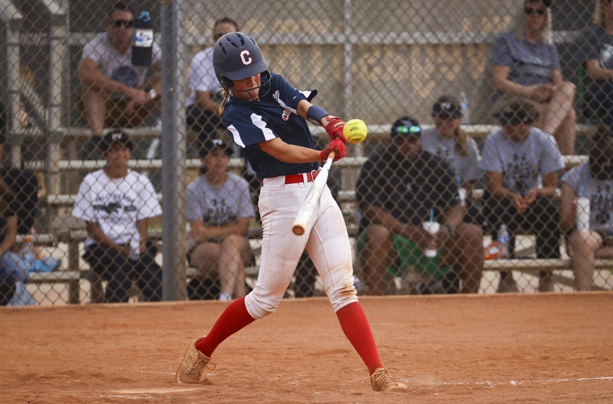 Coronado's Chase Magdaleno hits a single during a softball game at Palo Verde High School on Mo ...