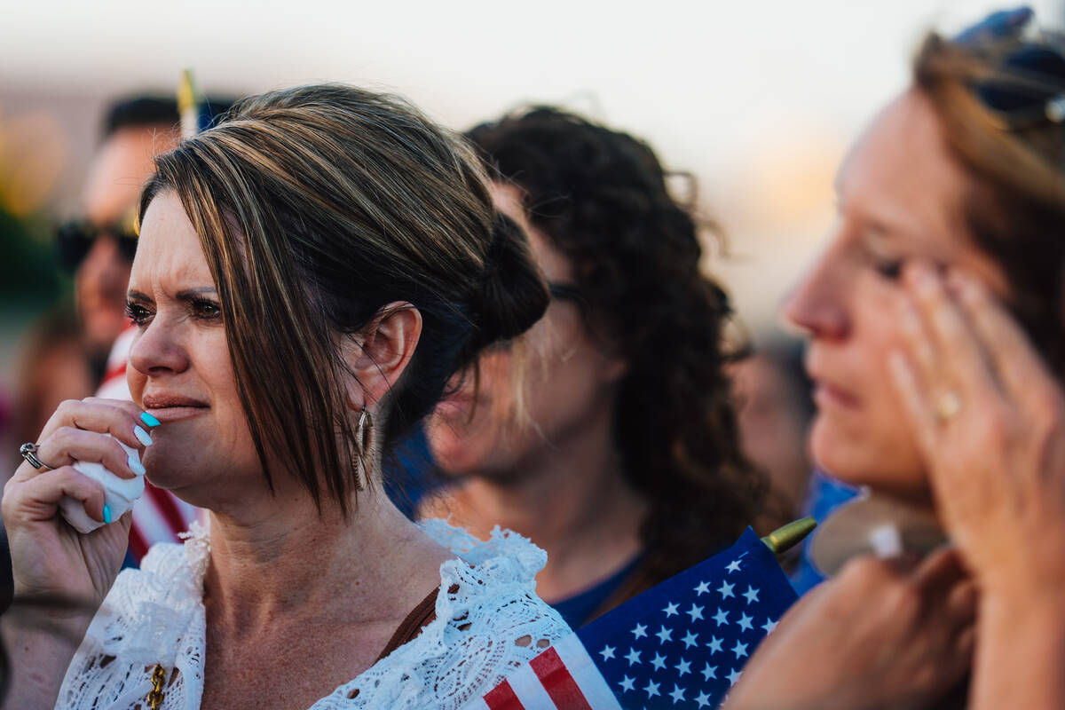 Mourners cry during a vigil for Jordon Dodder, who died after a crash at the intersection of Ru ...