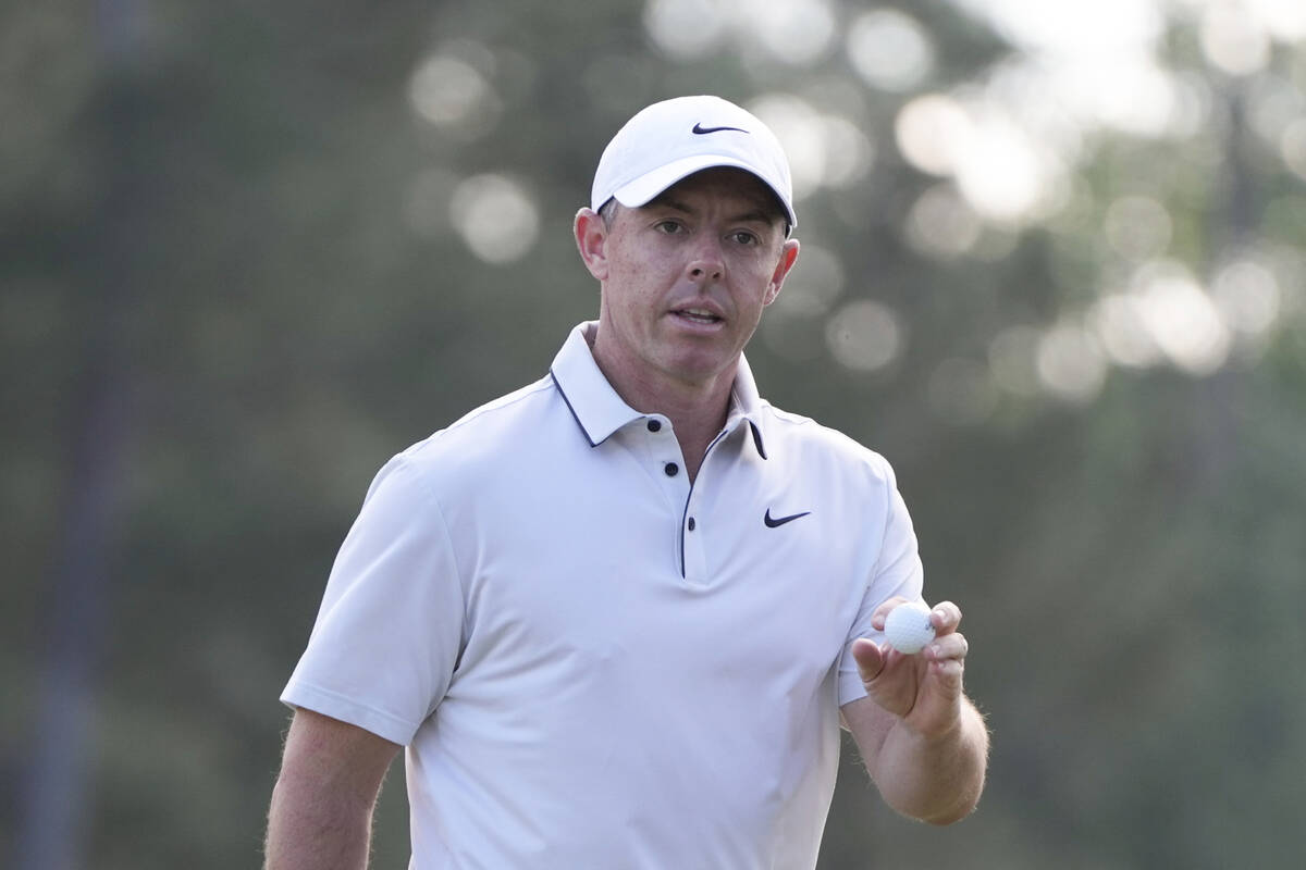 Rory McIlroy, of Northern Ireland, waves after making a putt on the 14th hole during the third ...