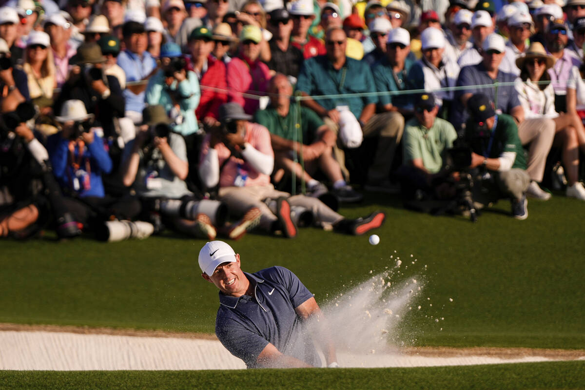 Rory McIlroy, of Northern Ireland, hits from the bunker on the 18th hole during the final round ...