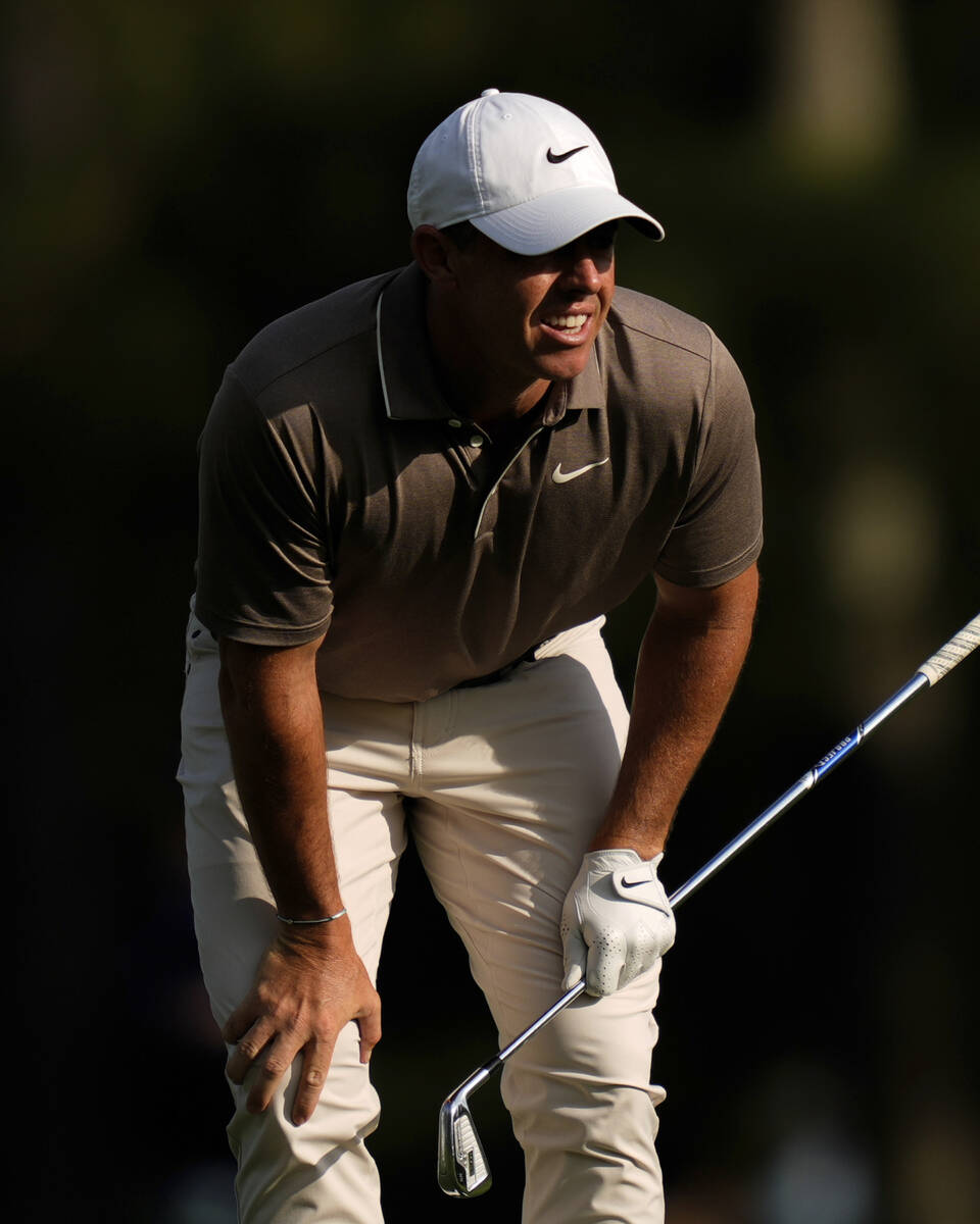 Rory McIlroy, of Northern Ireland, reacts after hitting from the fairway on the 15th hole durin ...