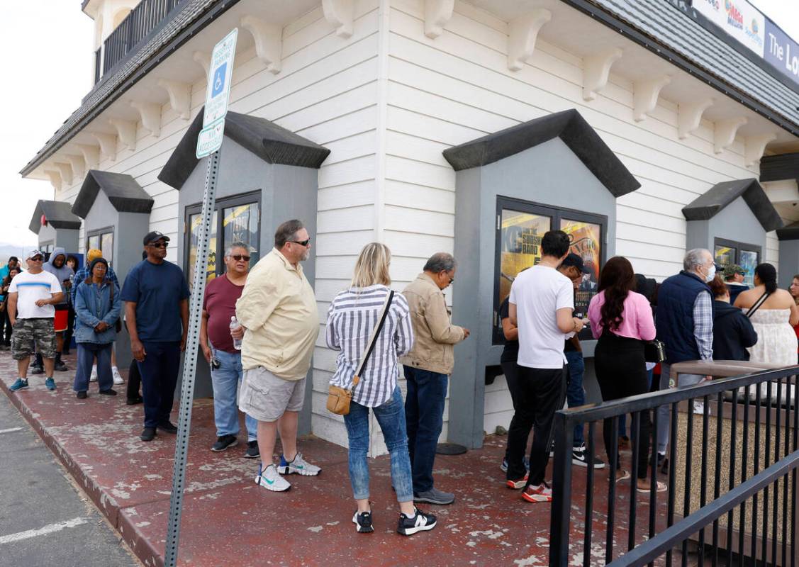 People line up outside of the Primm Valley Lotto Store to buy the Mega Million lottery tickets, ...
