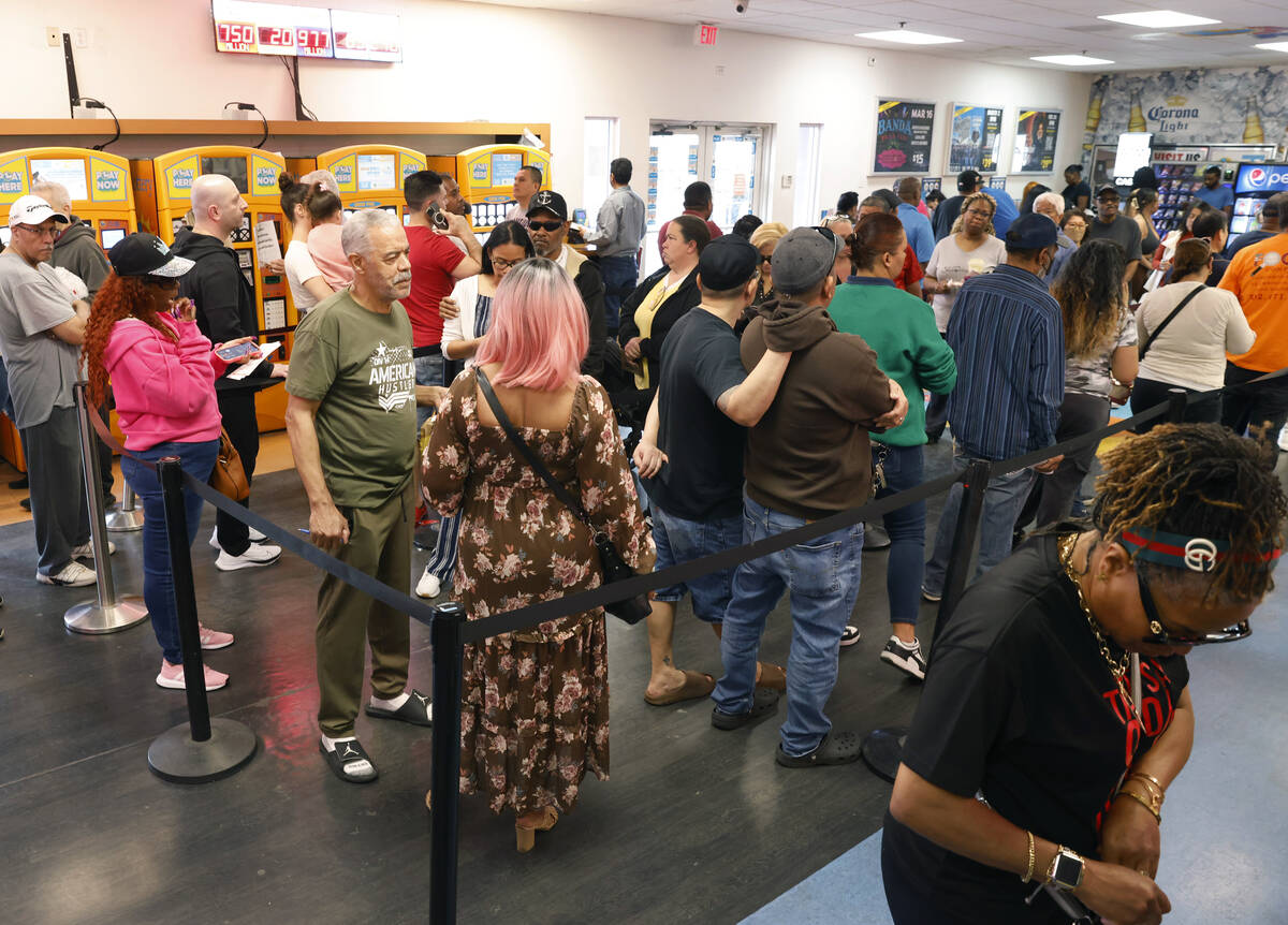 People line up at the Primm Valley Lotto Store to buy the Mega Million lottery tickets, on Frid ...
