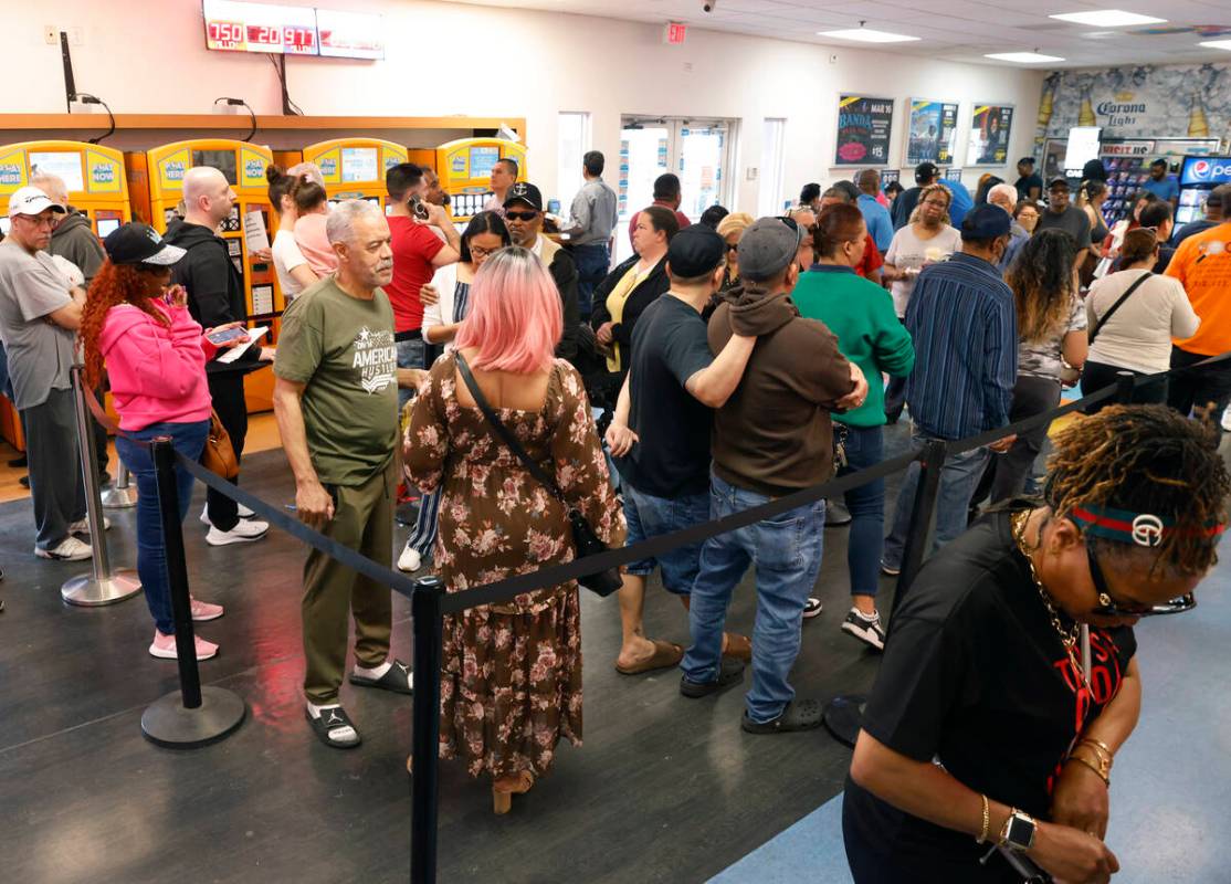 People line up at the Primm Valley Lotto Store to buy the Mega Million lottery tickets, on Frid ...