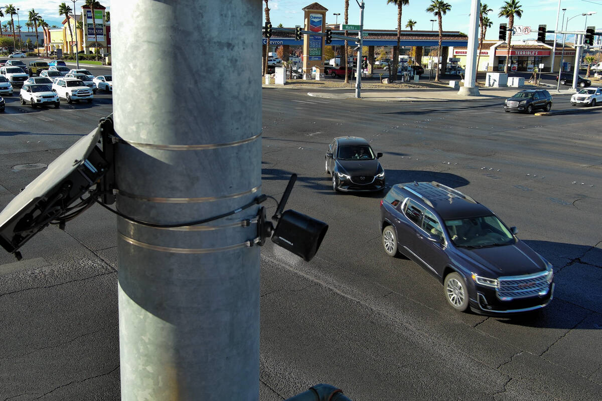 A license plate camera scans traffic at the intersection of Sunset Road and Marks Street in He ...